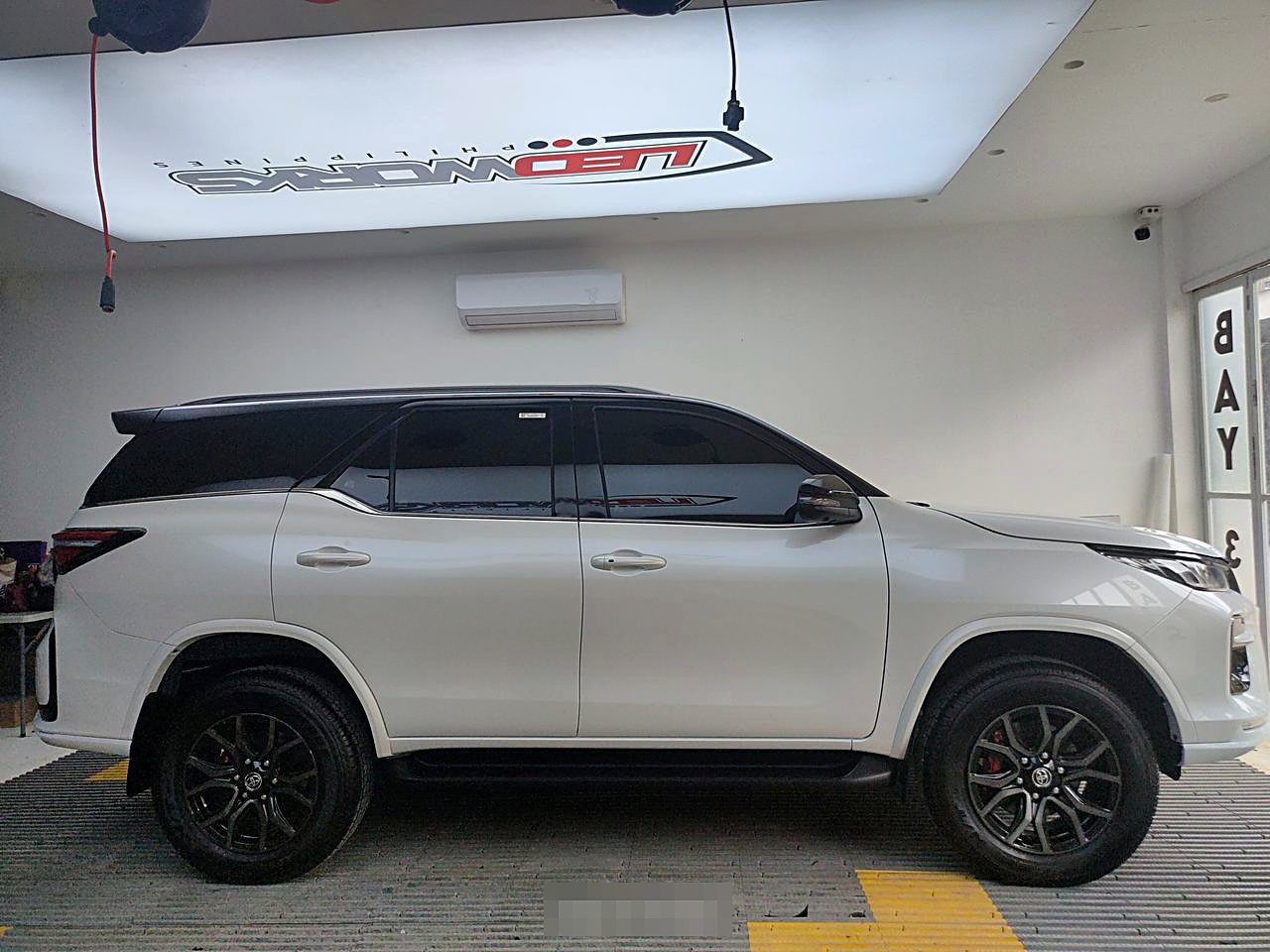 White Toyota Fortuner ceramic coated at the LEDWorks bay
